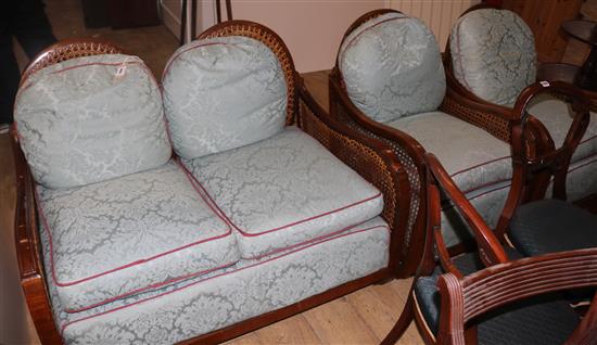 A 1930s walnut three piece bergere suite,